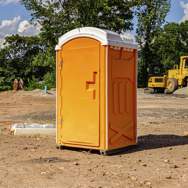 what is the cost difference between standard and deluxe portable restroom rentals in Cabot